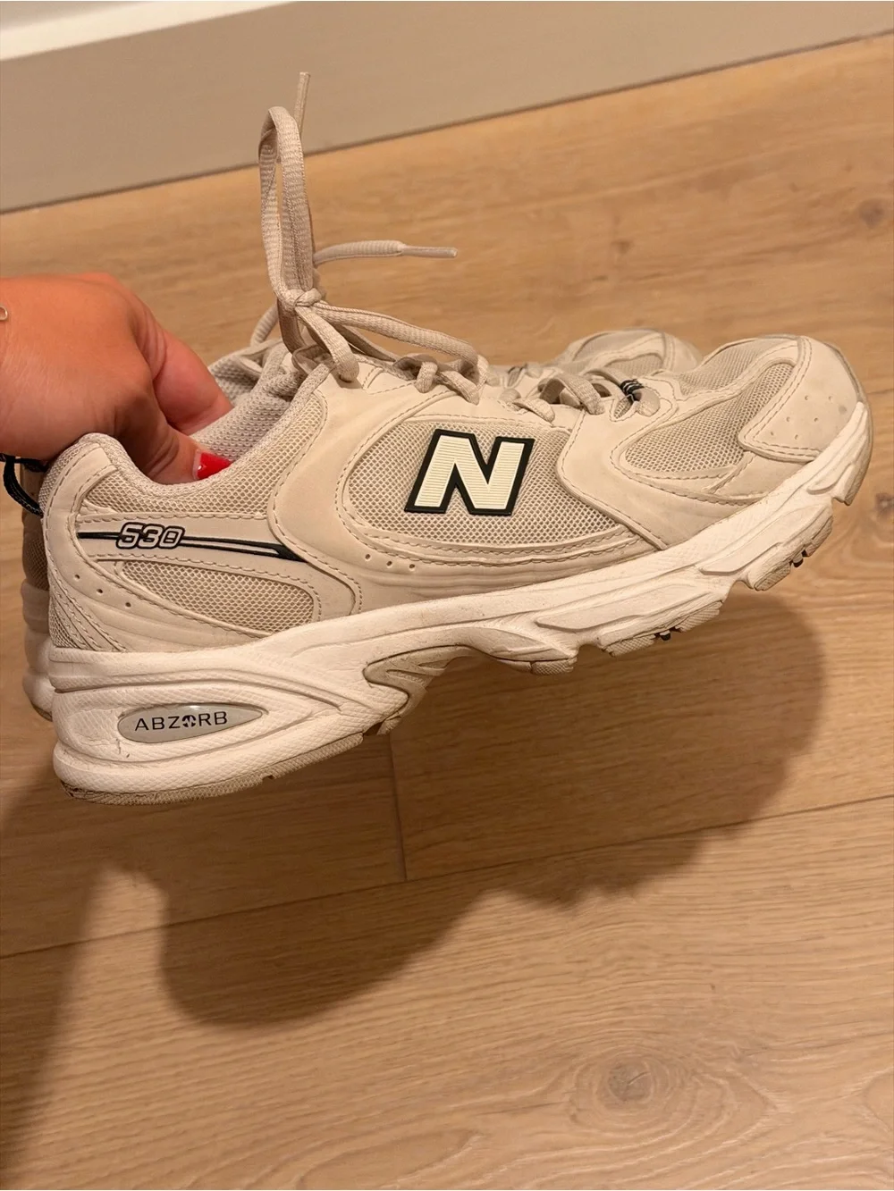 New Balance Cream Sneakers with Black Logo